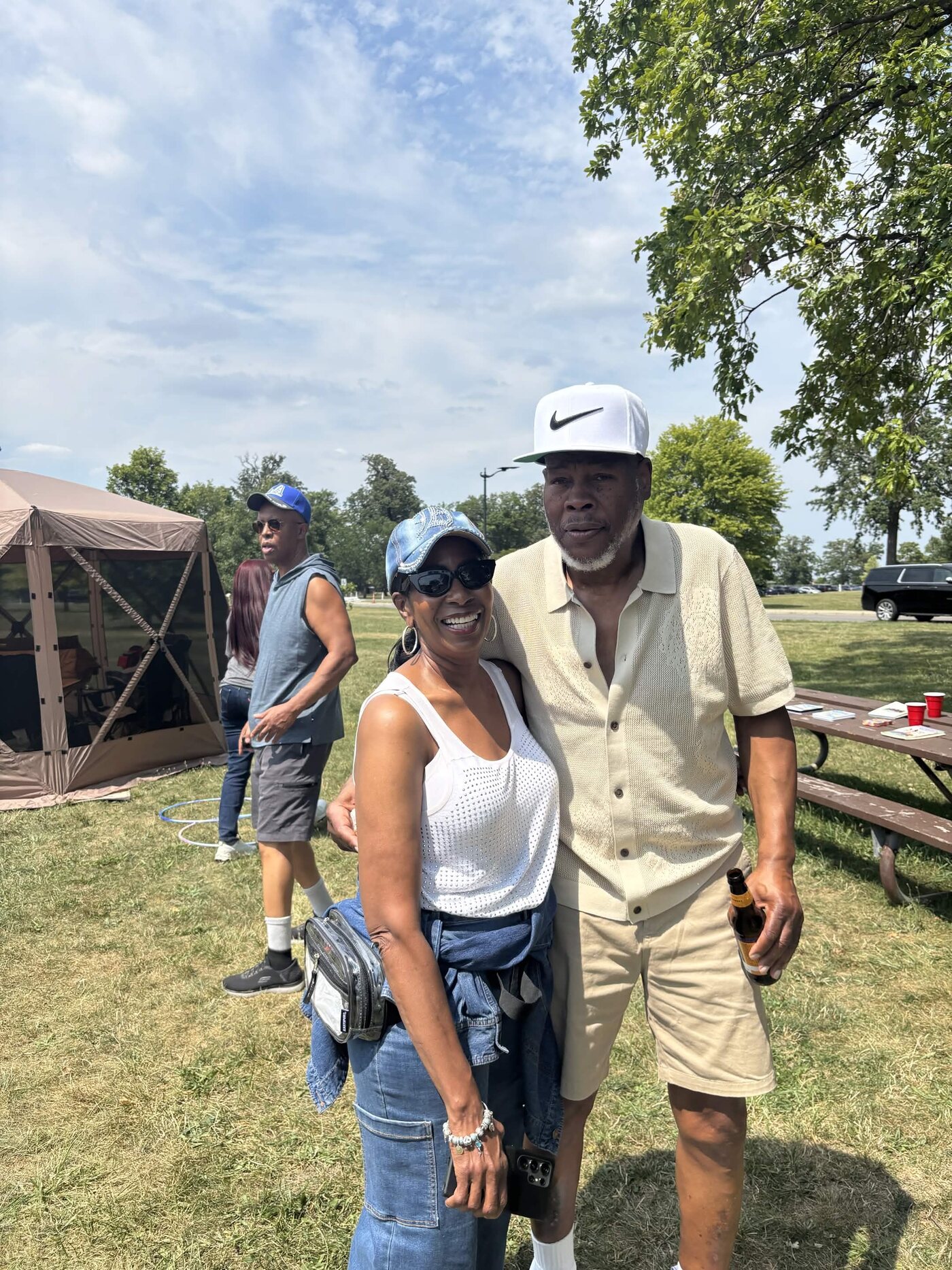 Smiling couple posing together at the family cookout